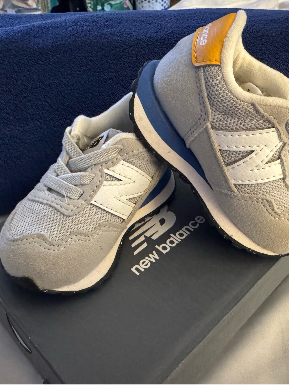 New Balance Kids Light Grey and White Infant orToddler Sneakers with Blue Accent